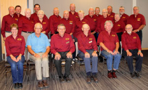 A group of older men posing for a photo.