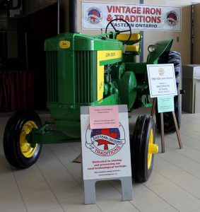 A green tractor on display.