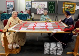 A group of women sitting at a table.