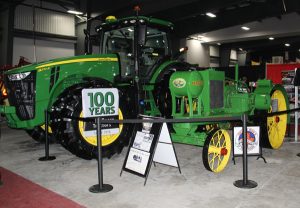 A green tractor on display.