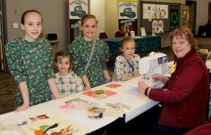 A group of girls at a table.