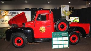A red and black truck on display.