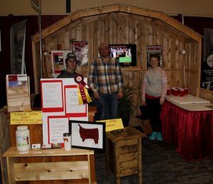 People standing in front of a booth.