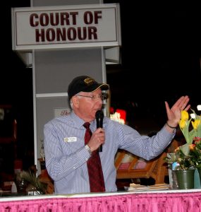 A man speaking into a microphone.