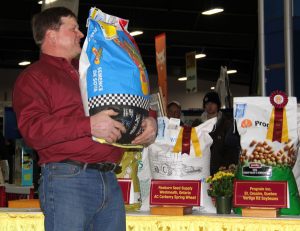 A man holding a bag of dog food.