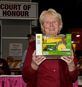 A woman holding a toy.