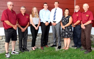 A group of people standing in front of a building.