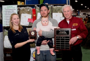 A man holding a baby and two people