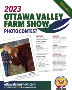 A child and a cow in front of the ottawa valley farm show.